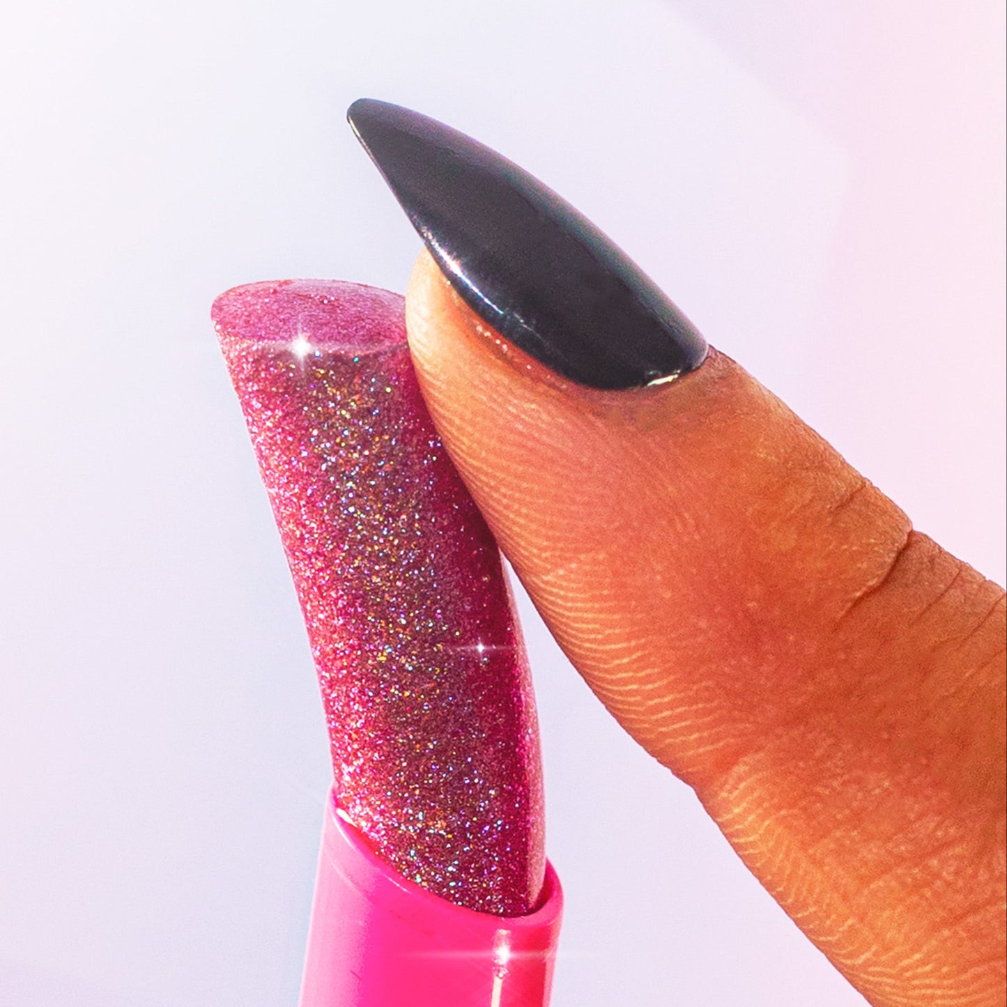 purple multi-use jelly stick with glittery texture against a white background