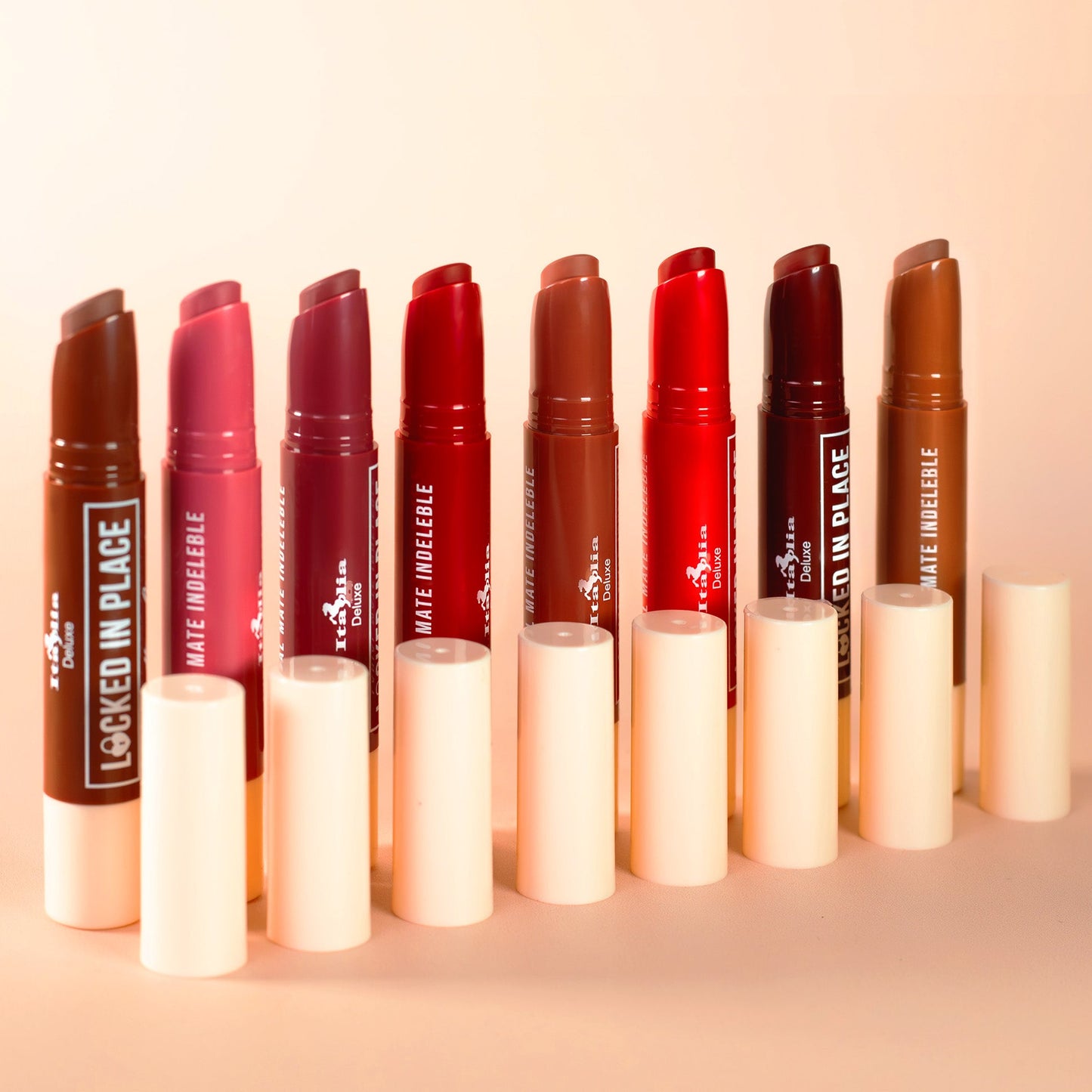 Set of italia deluxe nontransfer lipsticks, locked in place lippies, on a beige background