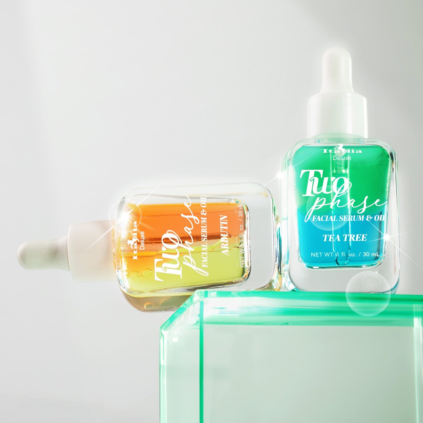 Two bottles of 'Two Phase' face serum on a light gray background