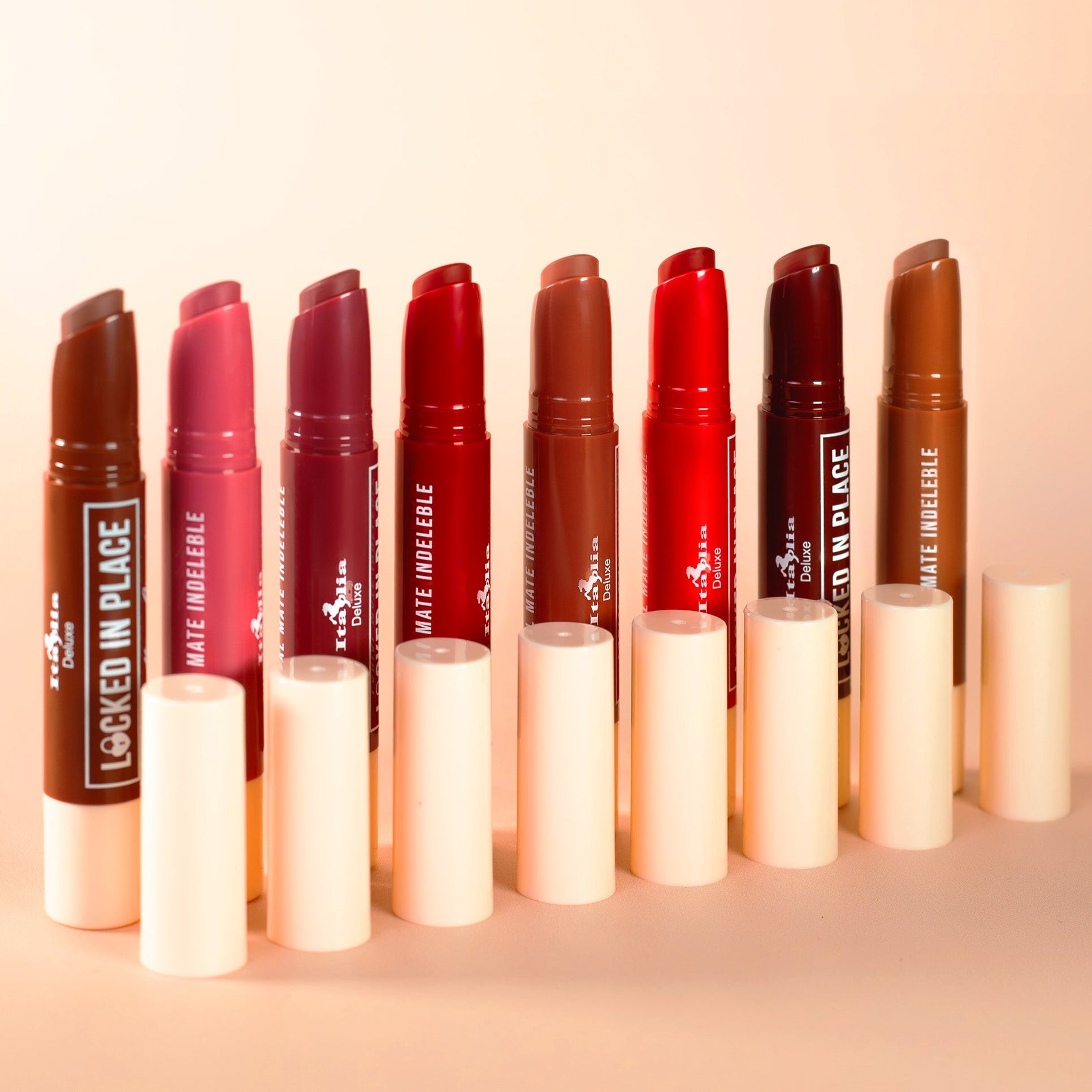 Set of italia deluxe nontransfer lipsticks, locked in place lippies, on a beige background
