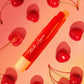 italia deluxe nonstransfer, colorstay, matte lippies on a yellow, red, pink accents background with cherries, it is cherry flavored, cherry scent. 