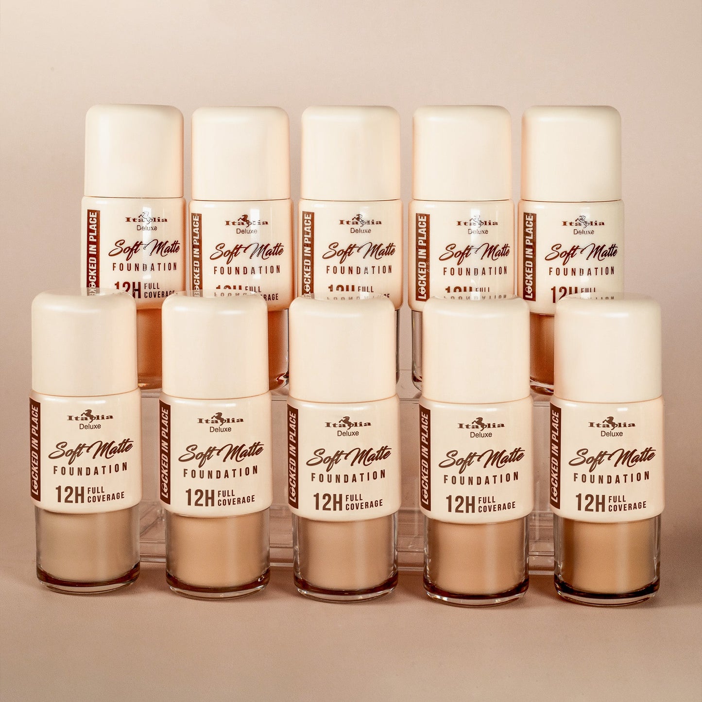 Multiple shades of Italia Deluxe Soft Matte Foundation displayed together, showing full coverage, non-transfer, soft matte finish, and 12-hour wear.