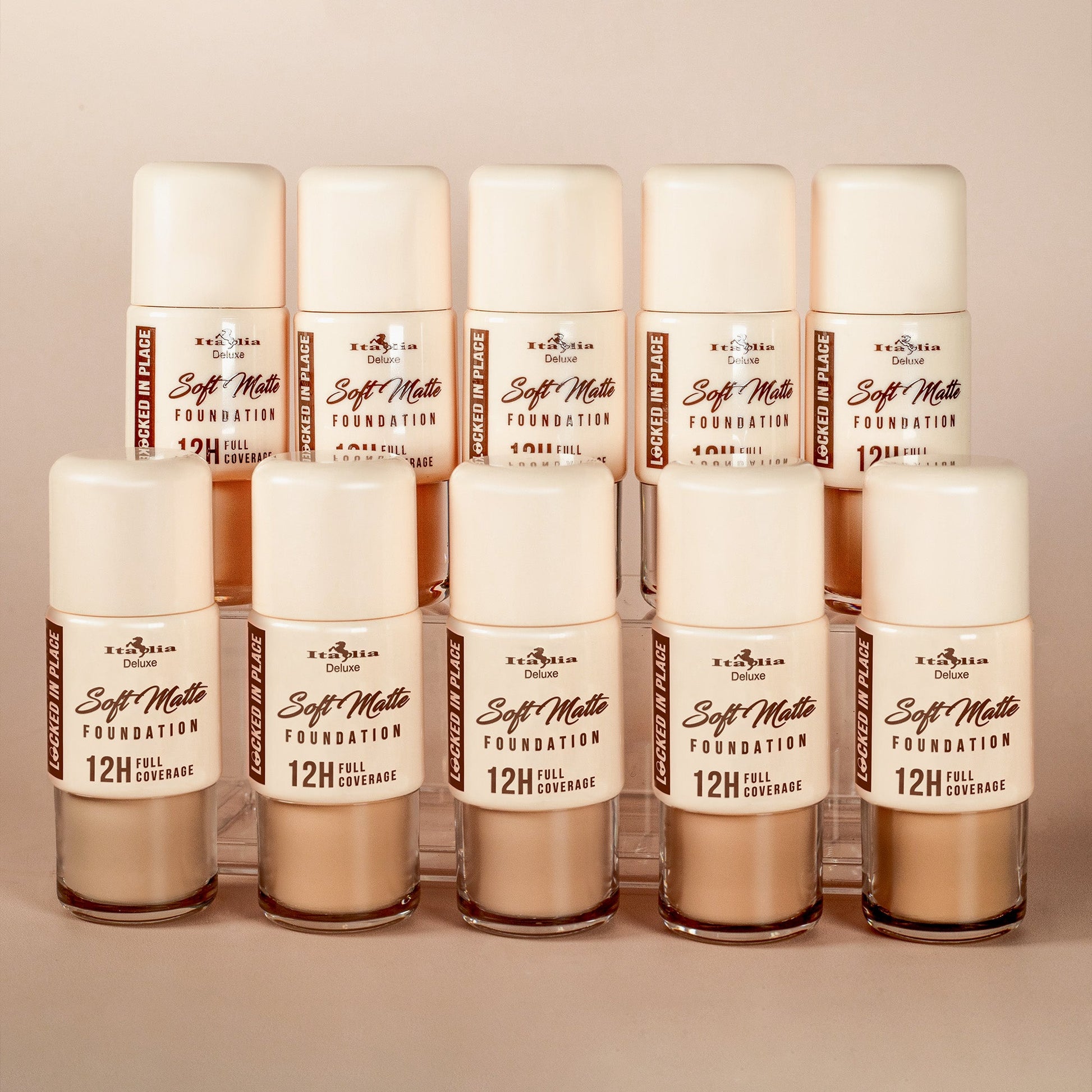 Multiple shades of Italia Deluxe Soft Matte Foundation displayed together, showing full coverage, non-transfer, soft matte finish, and 12-hour wear.