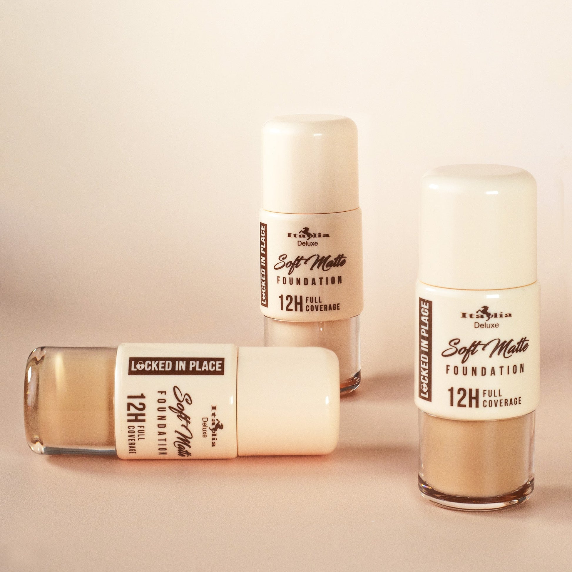 Three bottles of Soft Matte Foundation on a beige background