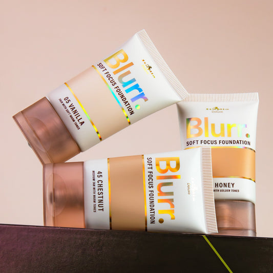 Two tubes of Blurr soft focus foundation on a beige background