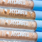 Close-up of HydraHit, hydrating creamy concealer tubes. 